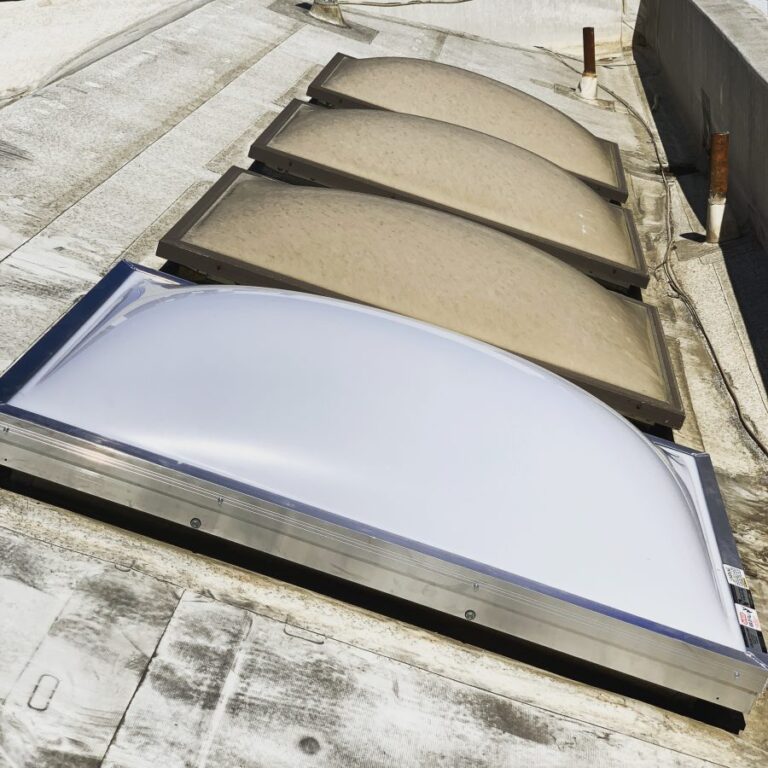 Acrylic dome skylight replacement in progress — one of four complete, Los Angeles